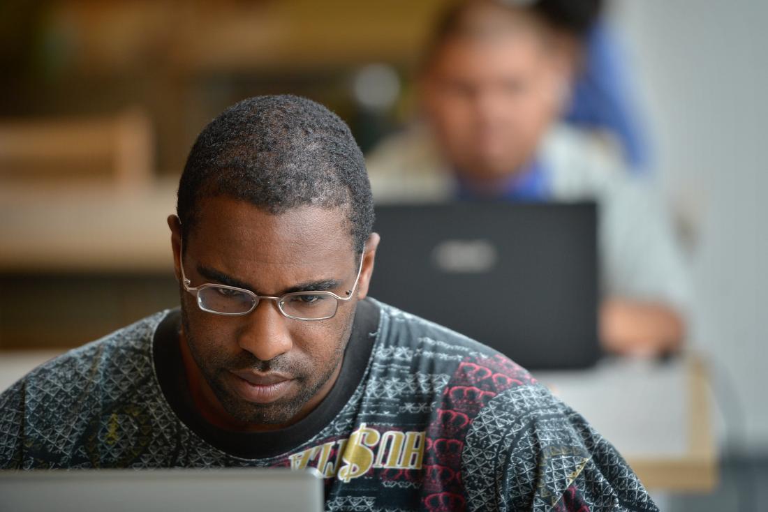 Male Student with a Laptop