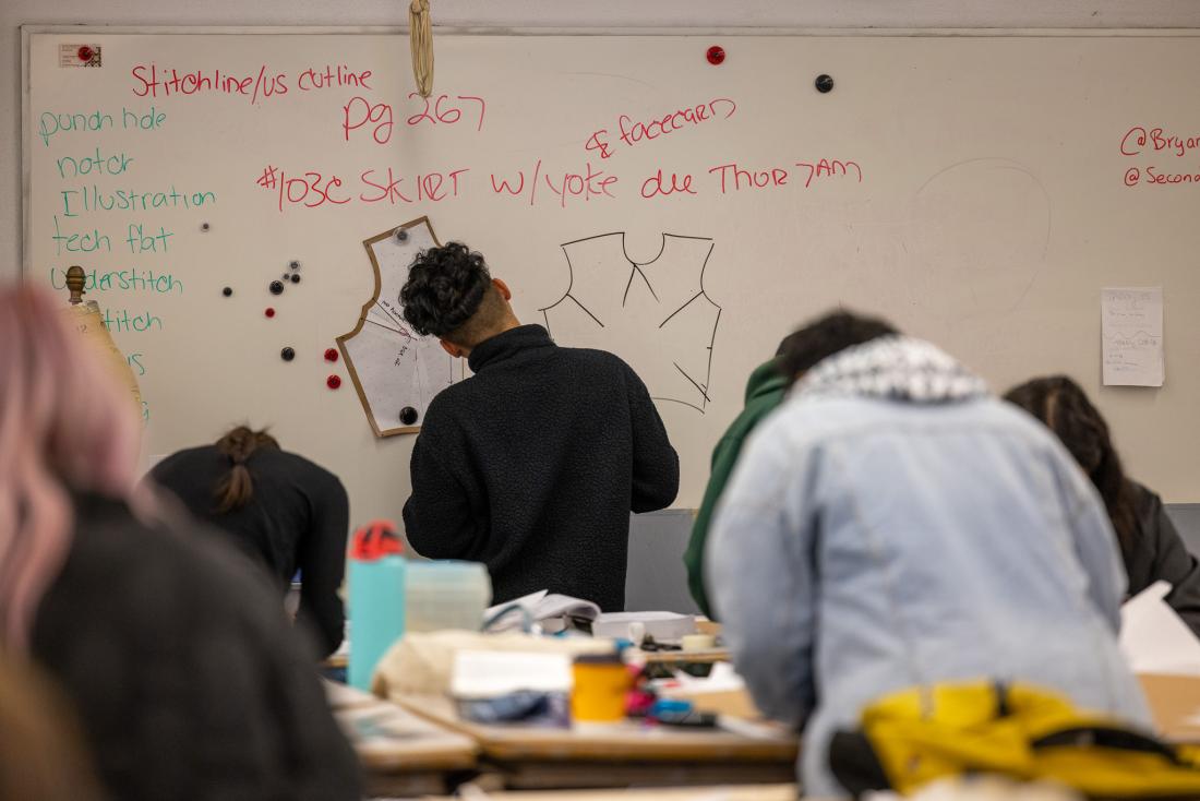 Student drawing patterns on whiteboard