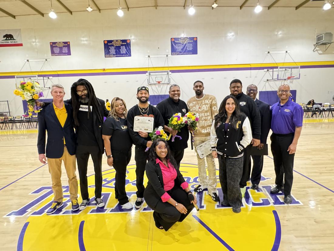 LATTC Administrators and ASO smile at basketball game