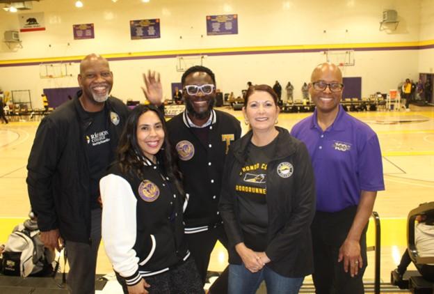 LATTC and Rio Hondo college administrators smile at game