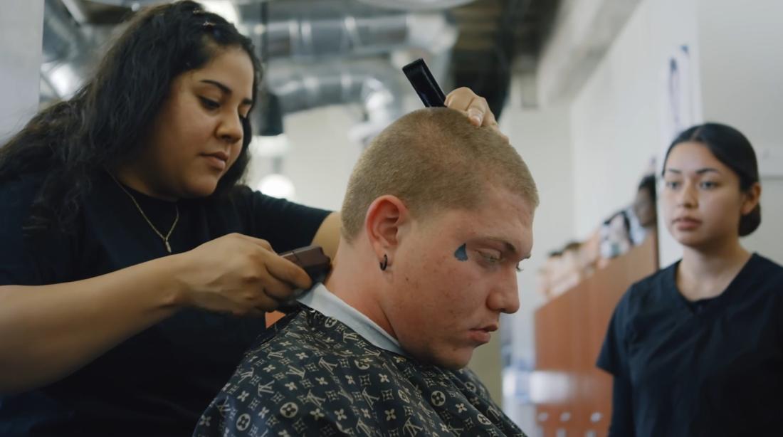 Student cutting hair